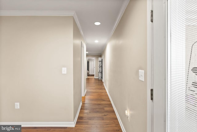 corridor with recessed lighting, baseboards, wood finished floors, and crown molding