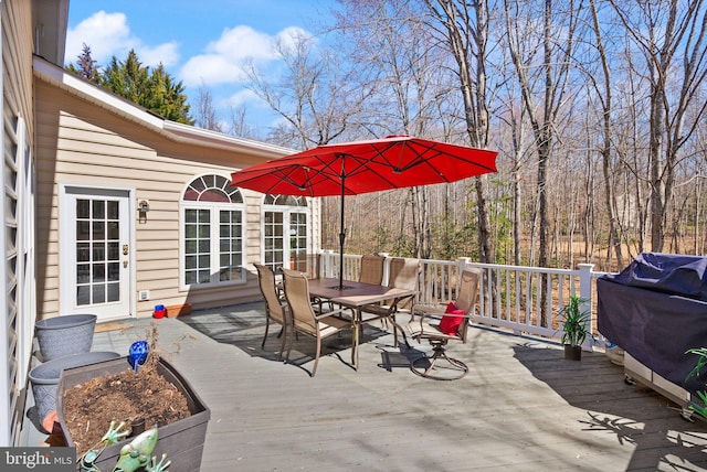 view of patio / terrace featuring area for grilling, outdoor dining area, and a deck