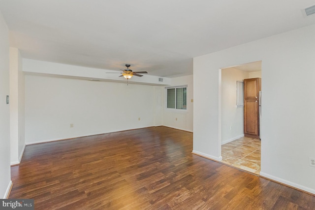 8500 Laguna Ct Unit 218, Alexandria, VA 22309 - spare room featuring visible vents, wood finished floors, baseboards, and ceiling fan