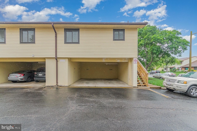 8500 Laguna Ct Unit 218, Alexandria, VA 22309 - view of front of home featuring covered parking and stairs