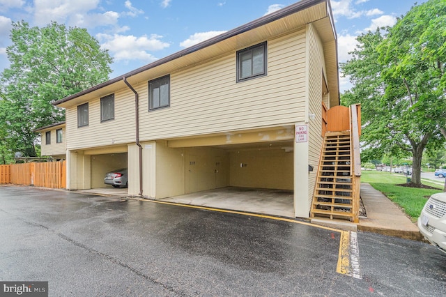 8500 Laguna Ct Unit 218, Alexandria, VA 22309 - view of front of property with covered parking, fence, and stairs