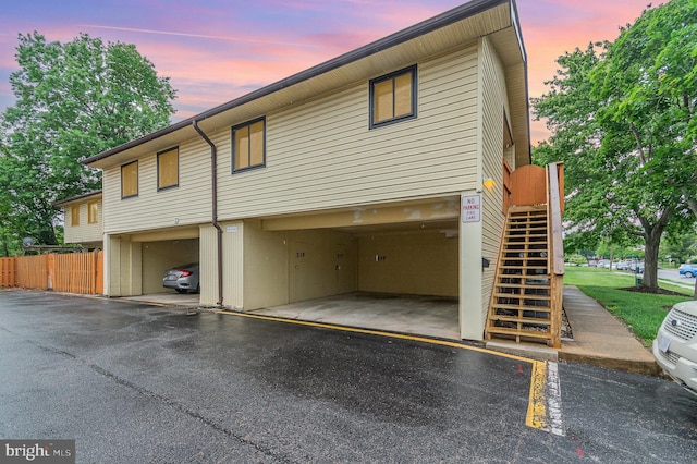 8500 Laguna Ct Unit 218, Alexandria, VA 22309 - view of front of home featuring uncovered parking, fence, and stairs
