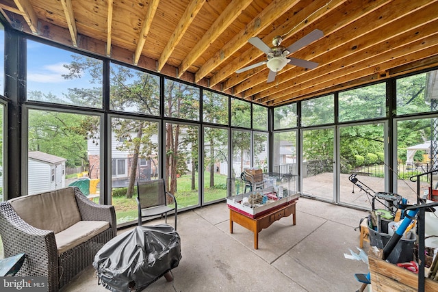 sunroom with a ceiling fan