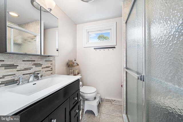 full bath with backsplash, a shower stall, toilet, tile patterned flooring, and vanity