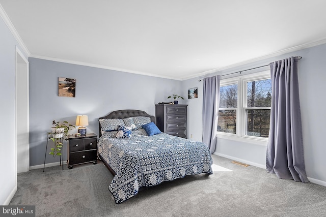 bedroom with visible vents, baseboards, crown molding, and carpet