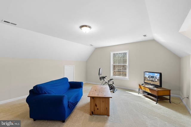 sitting room featuring carpet, lofted ceiling, baseboards, and visible vents