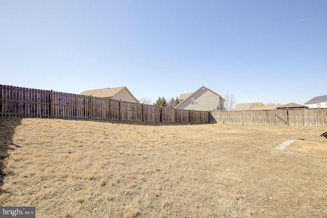 view of yard featuring a fenced backyard