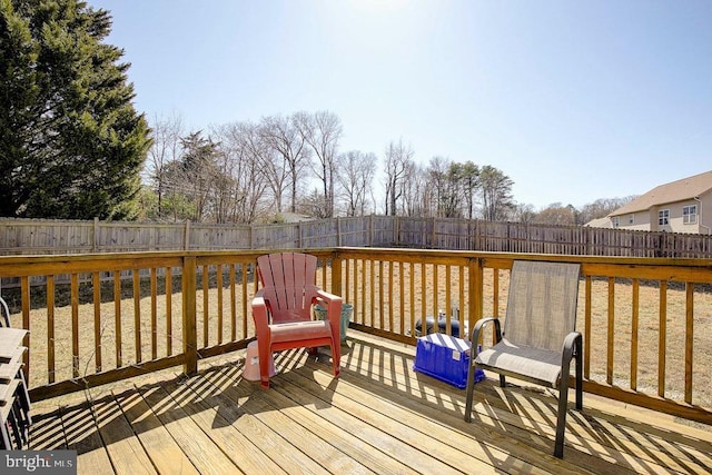 deck with a fenced backyard