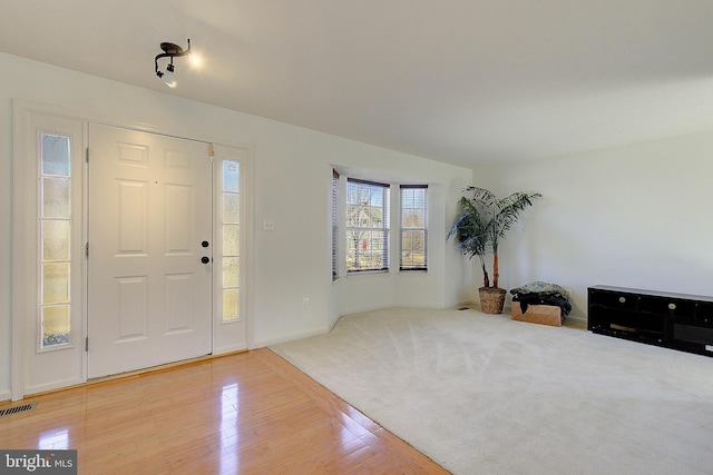 foyer with visible vents and light wood-style flooring