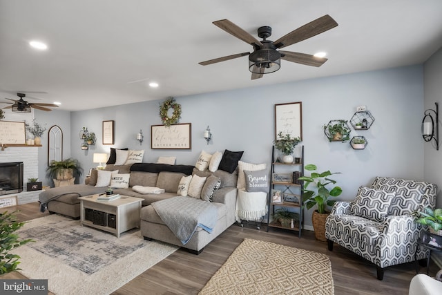 living room with recessed lighting, a fireplace, ceiling fan, and wood finished floors