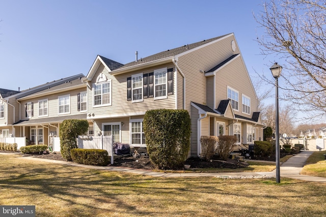 view of property with a front lawn