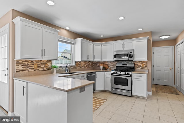 10 Silver Maple Dr, Boiling Springs, PA 17007 - kitchen with stainless steel appliances, a sink, light tile patterned flooring, light countertops, and recessed lighting