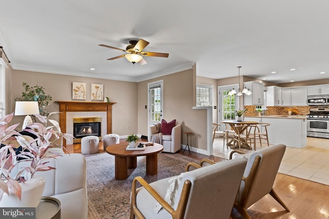 10 Silver Maple Dr, Boiling Springs, PA 17007 - living room with a ceiling fan, a fireplace, crown molding, recessed lighting, and light wood-type flooring