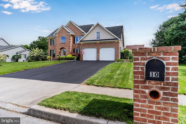 10 Silver Maple Dr, Boiling Springs, PA 17007 - view of front of home with brick siding, driveway, and a front lawn