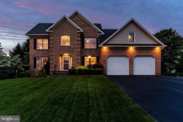 10 Silver Maple Dr, Boiling Springs, PA 17007 - view of front of house with an attached garage, a yard, asphalt driveway, and brick siding
