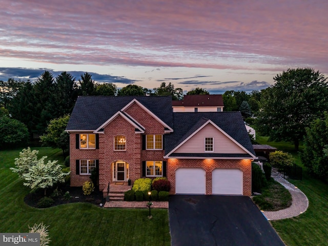 10 Silver Maple Dr, Boiling Springs, PA 17007 - colonial house featuring asphalt driveway, a garage, a yard, and brick siding