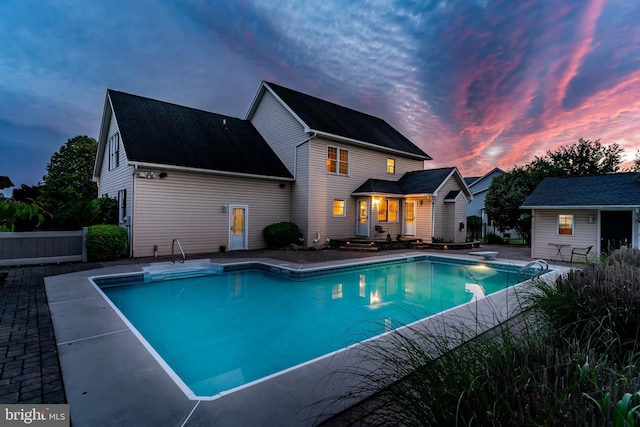10 Silver Maple Dr, Boiling Springs, PA 17007 - pool at dusk with an outdoor pool, a patio area, and a diving board