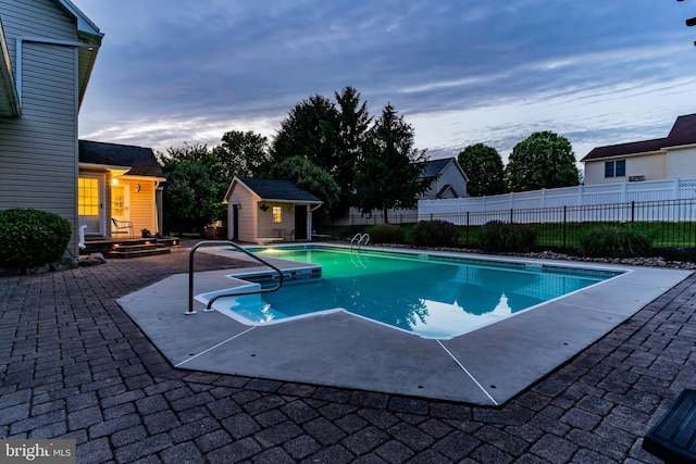 10 Silver Maple Dr, Boiling Springs, PA 17007 - pool at dusk with a patio and an outdoor structure