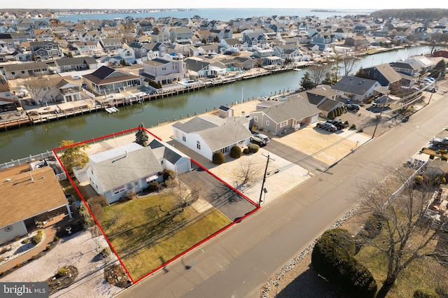 bird's eye view with a residential view and a water view