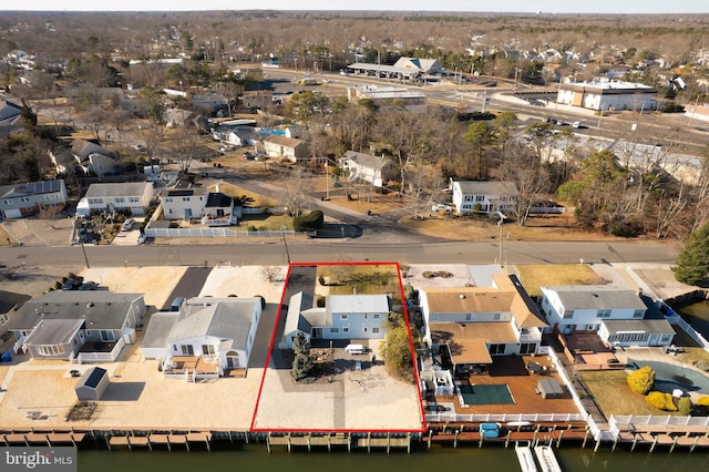 aerial view with a residential view and a water view