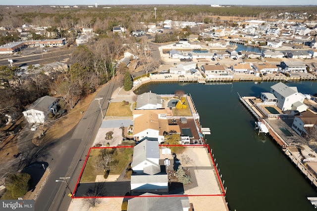 birds eye view of property featuring a residential view and a water view