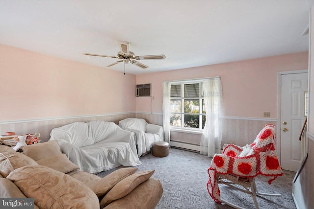 living room featuring a wall mounted air conditioner, a ceiling fan, a baseboard heating unit, carpet floors, and wainscoting