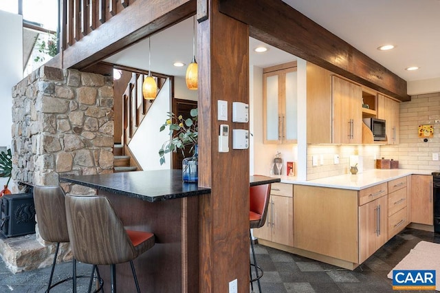 kitchen with tasteful backsplash, decorative light fixtures, a breakfast bar, recessed lighting, and open shelves