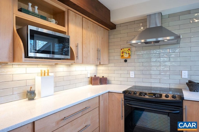 kitchen with stainless steel microwave, extractor fan, black range with electric stovetop, and light brown cabinetry