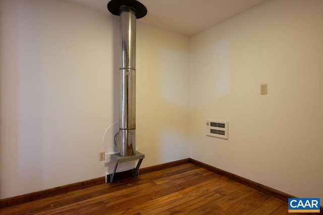 interior details featuring baseboards and wood finished floors