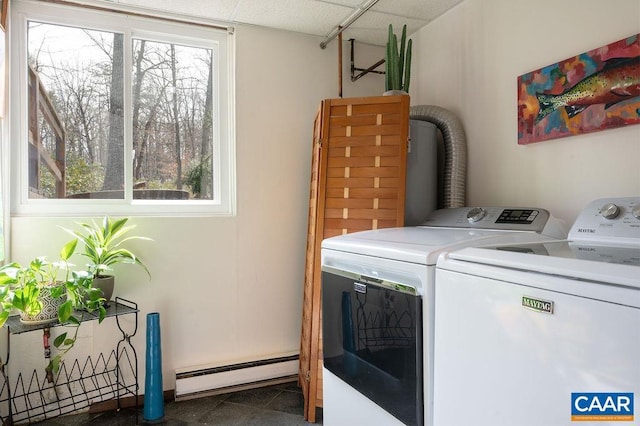 laundry area featuring a baseboard heating unit, plenty of natural light, independent washer and dryer, and laundry area