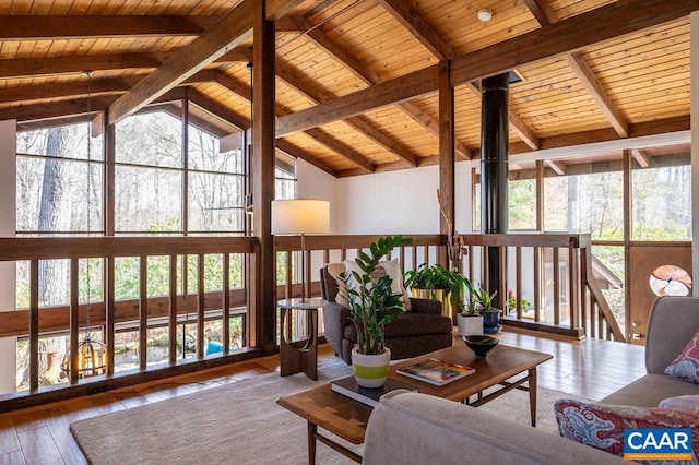 sunroom / solarium featuring wooden ceiling and vaulted ceiling with beams