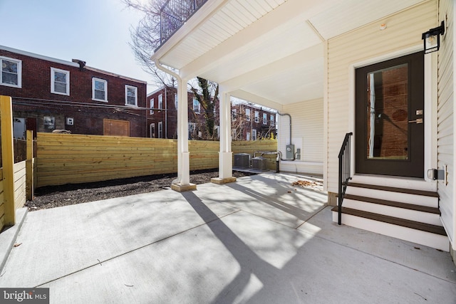 view of patio / terrace with entry steps and fence