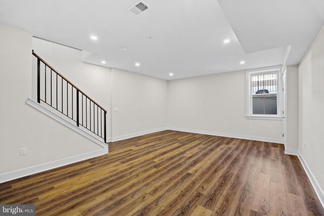 basement featuring stairway, wood finished floors, visible vents, baseboards, and recessed lighting