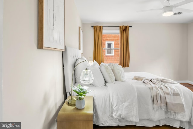 bedroom with baseboards and a ceiling fan