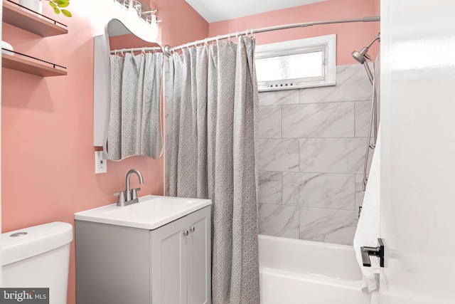 bathroom with vanity, toilet, and shower / bath combo