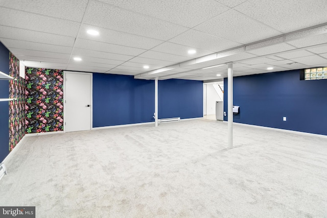 finished basement featuring recessed lighting, baseboards, carpet floors, and a paneled ceiling