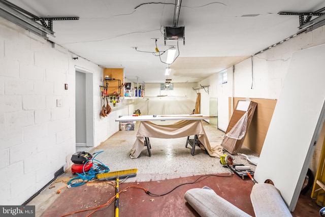 garage with concrete block wall