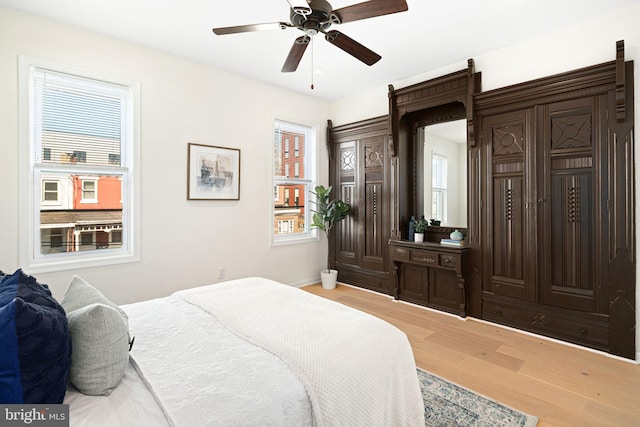 bedroom featuring light wood finished floors and ceiling fan