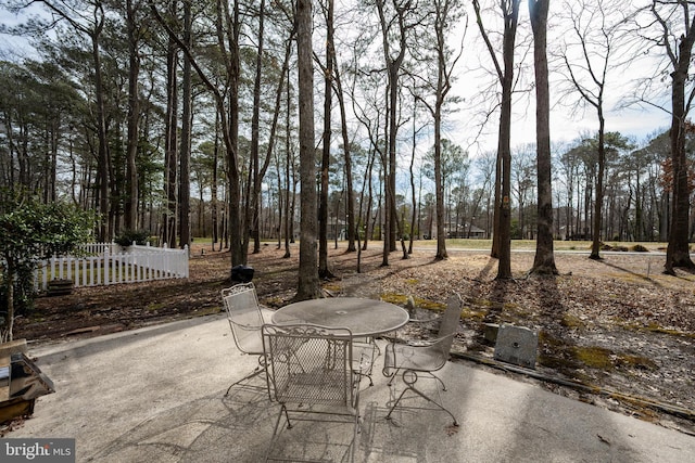 view of patio / terrace with outdoor dining area and fence