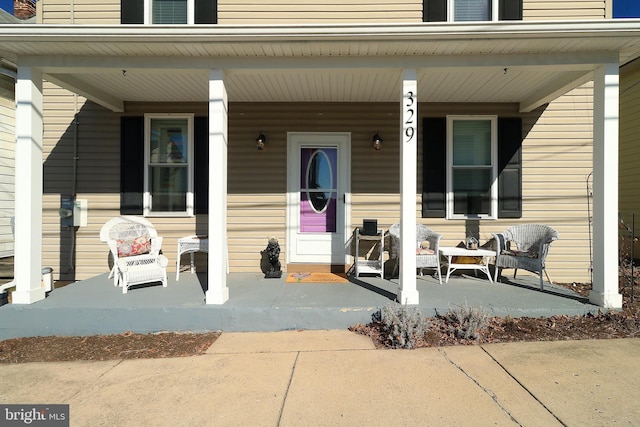 doorway to property with covered porch