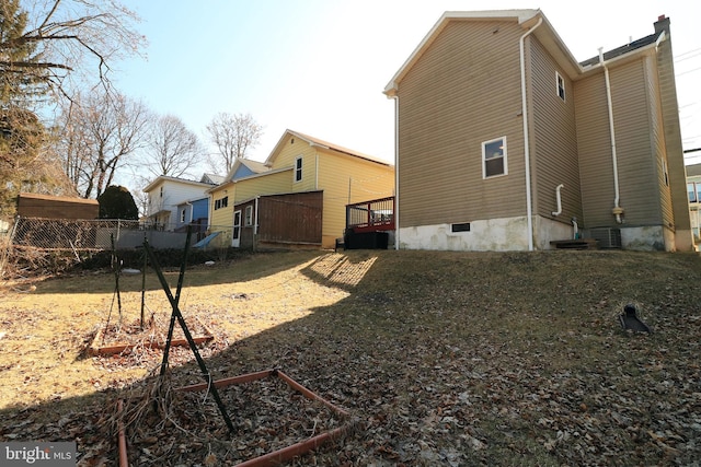 rear view of house featuring a garden