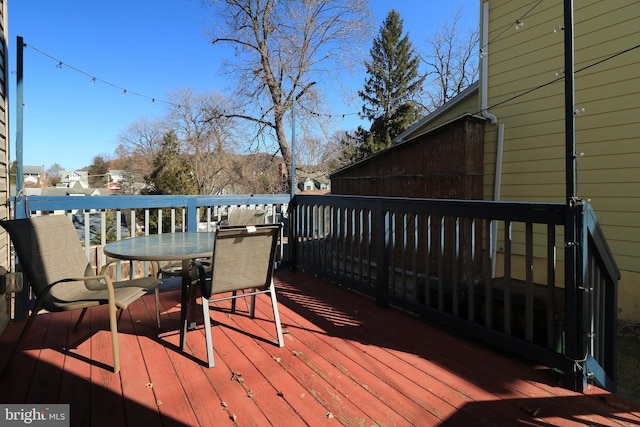 wooden deck with outdoor dining area