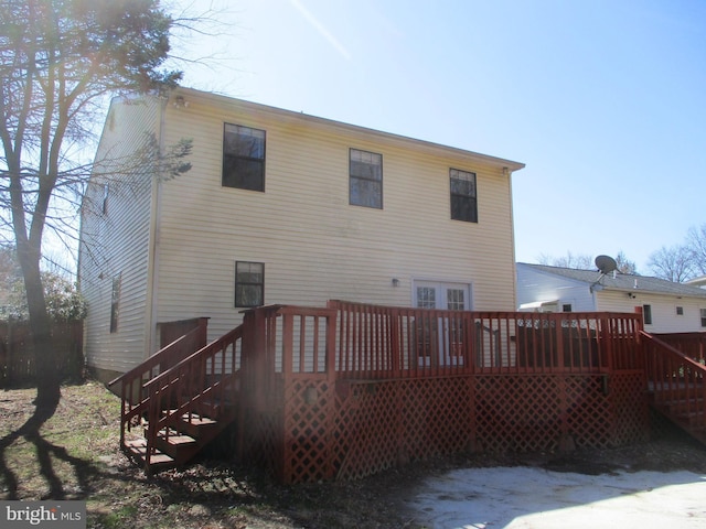 back of house featuring a deck