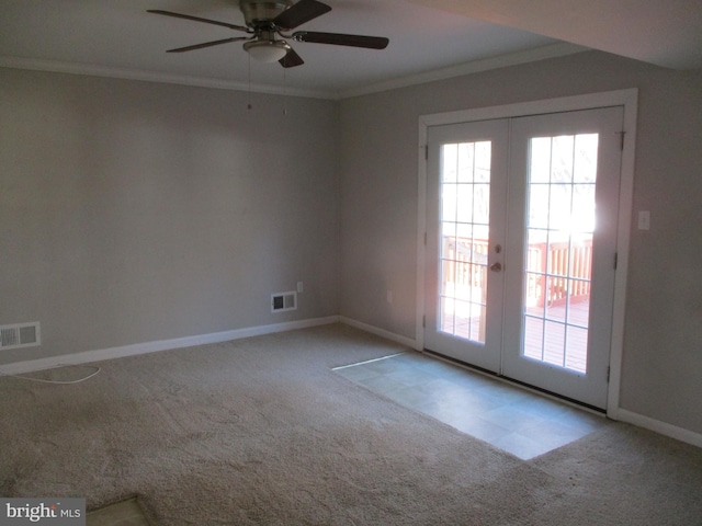 unfurnished room featuring carpet, visible vents, and ornamental molding