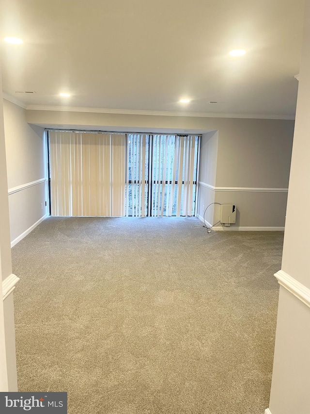 unfurnished room featuring recessed lighting, baseboards, carpet floors, and ornamental molding