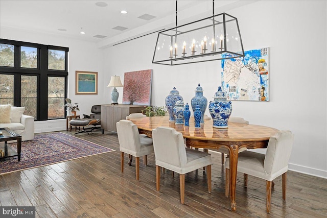 dining space featuring hardwood / wood-style flooring, recessed lighting, and baseboards