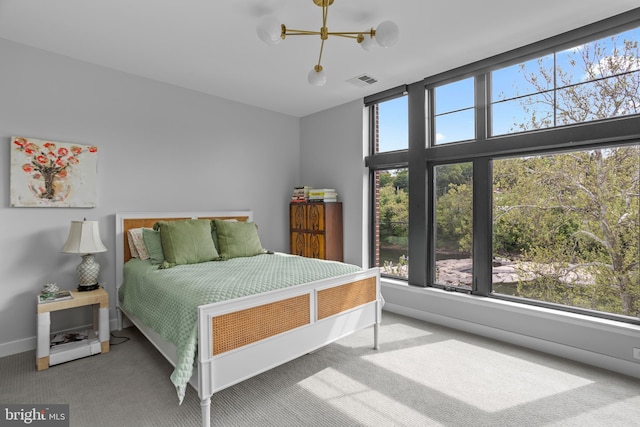 bedroom featuring multiple windows, carpet, and visible vents