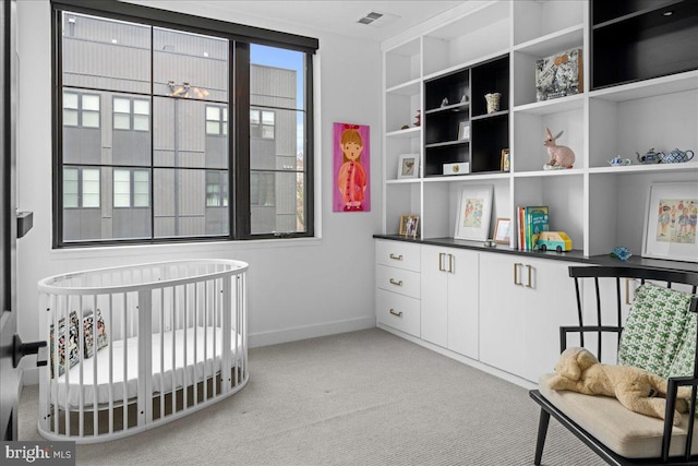 bedroom with visible vents, light colored carpet, and baseboards