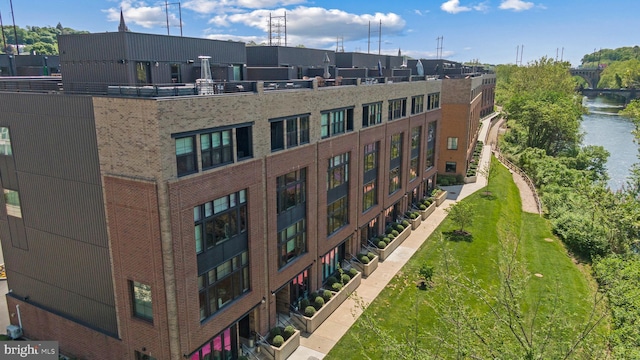 view of building exterior featuring a water view