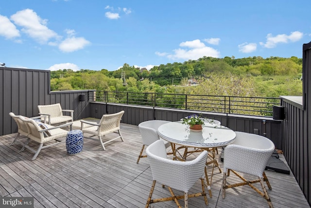 deck featuring a view of trees